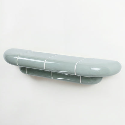 Orbi designer floating shelf in glossy Pastel Mint finish, handcrafted in Spain.