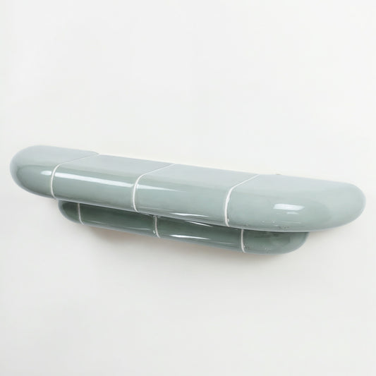 Orbi designer floating shelf in glossy Pastel Mint finish, handcrafted in Spain.