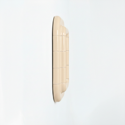 Side view of a Soft Butter ceramic-inspired mirror, revealing its depth, layered form, and smooth glossy finish.