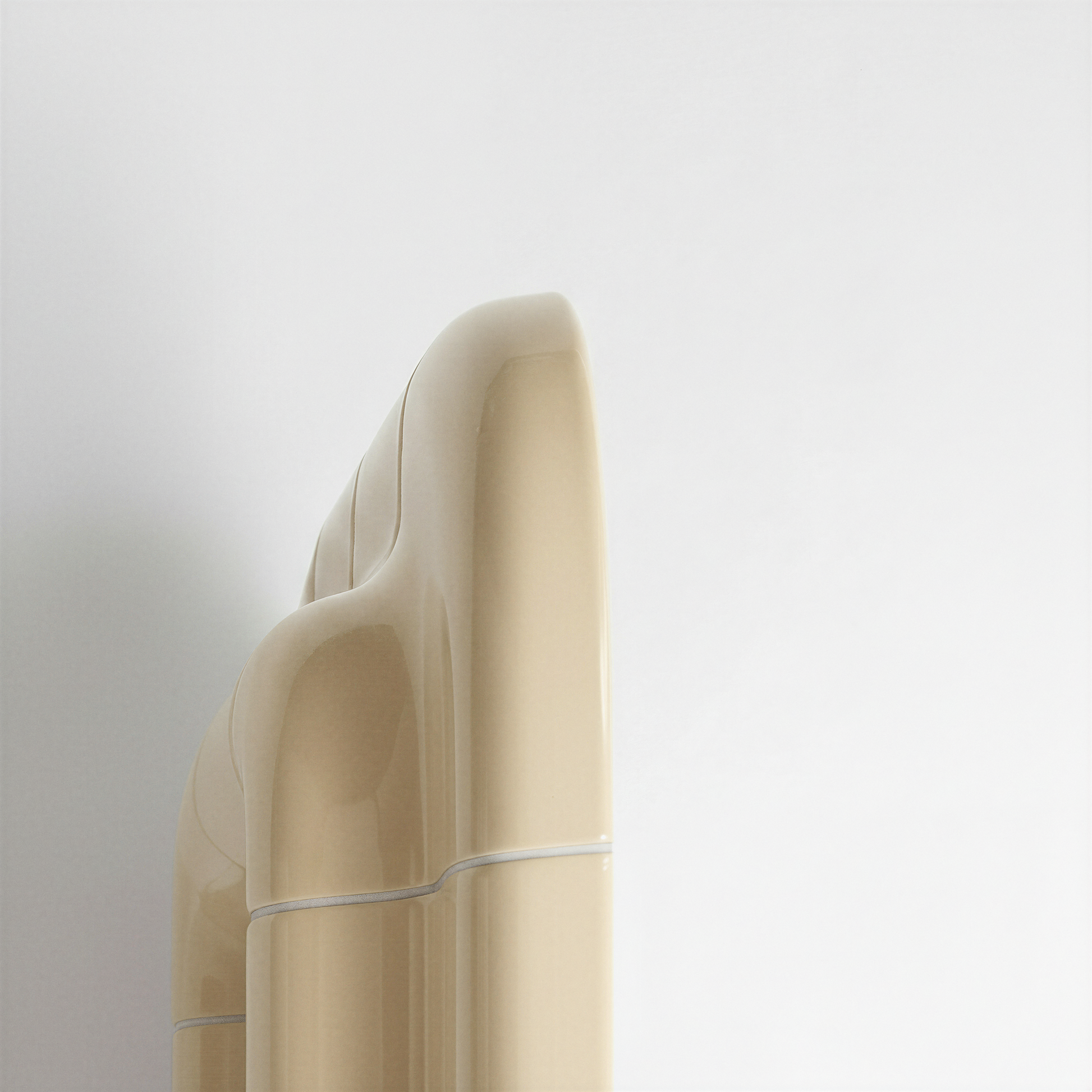 Detailed side profile of a Soft Butter ceramic-look mirror, emphasizing its sculptural thickness and curved geometry.