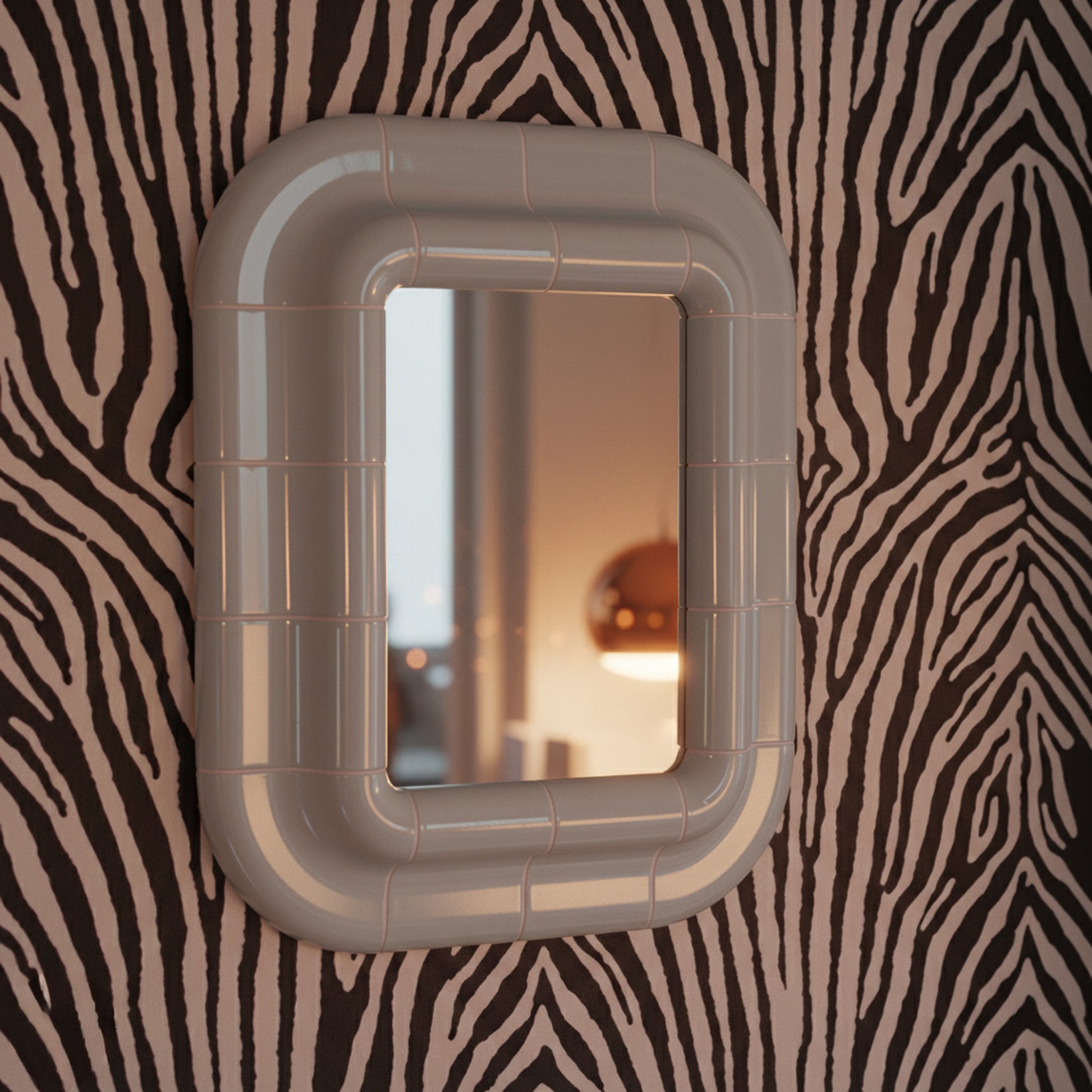 Ice Blue ceramic-look mirror shown in angled perspective, highlighting rounded edges and glossy finish.