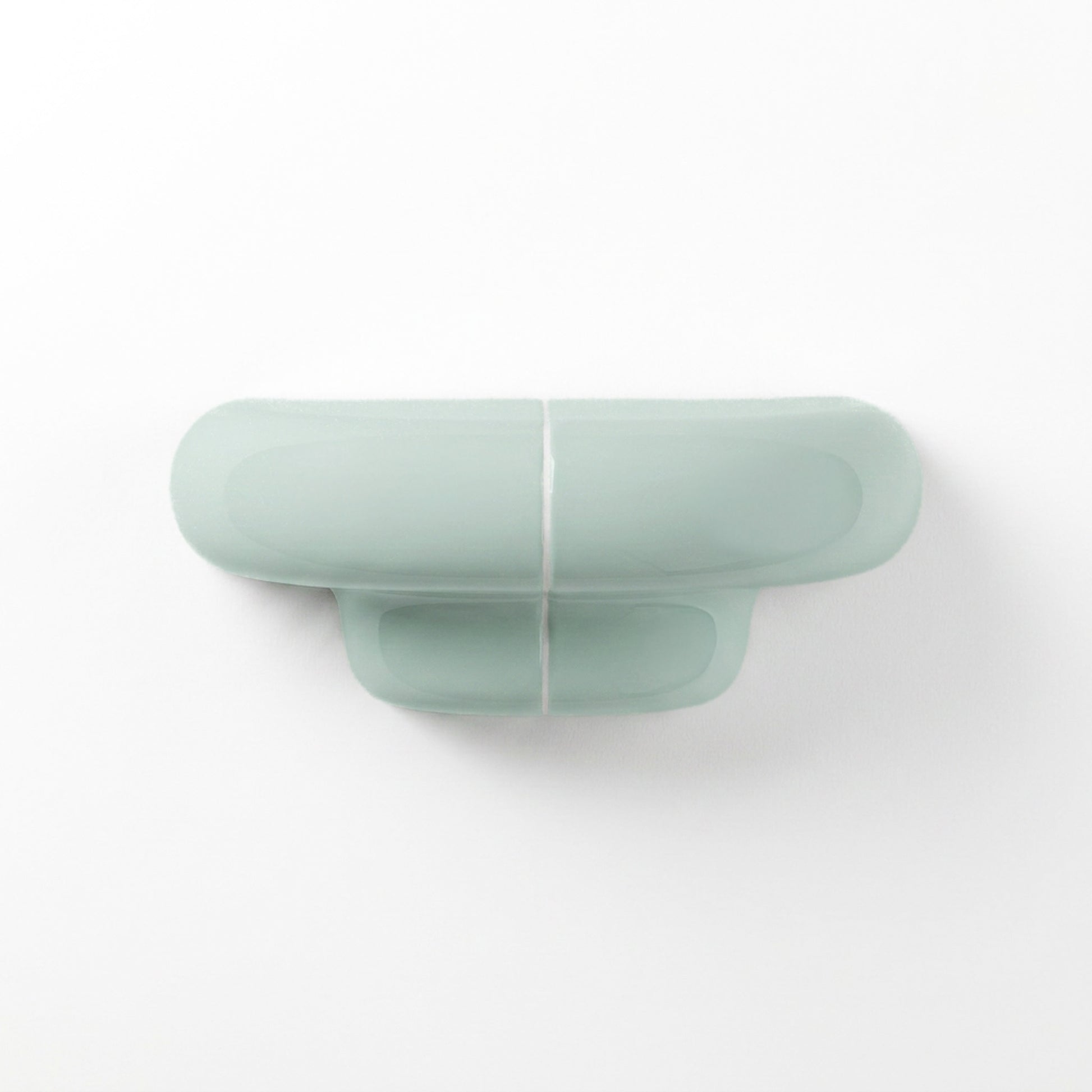 Orbi XS floating wall shelf in glossy Pastel Mint, modern handcrafted shelf for contemporary interiors.