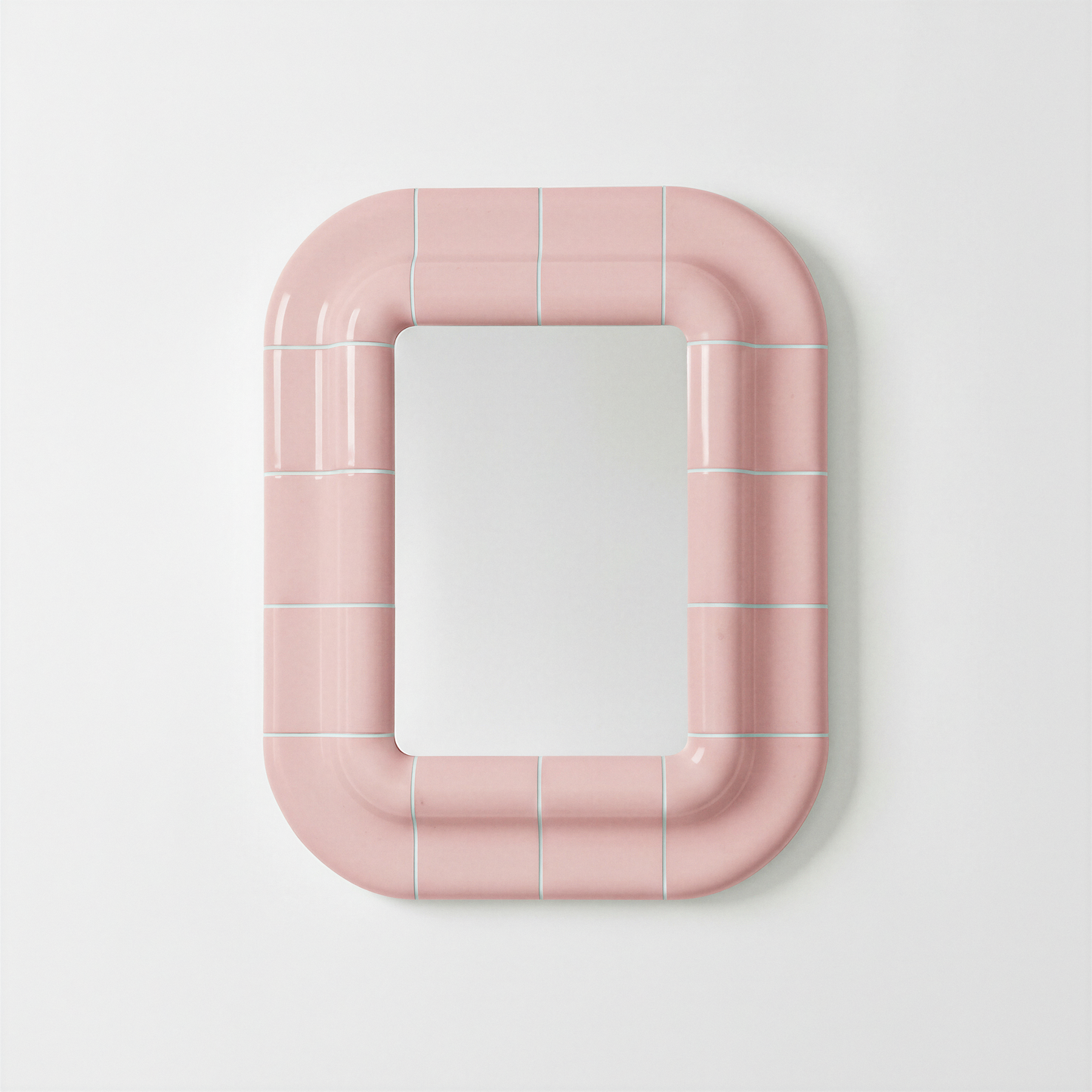 Ceramic-look rectangular mirror with rounded corners and visible joints, Lola model in blush pink.