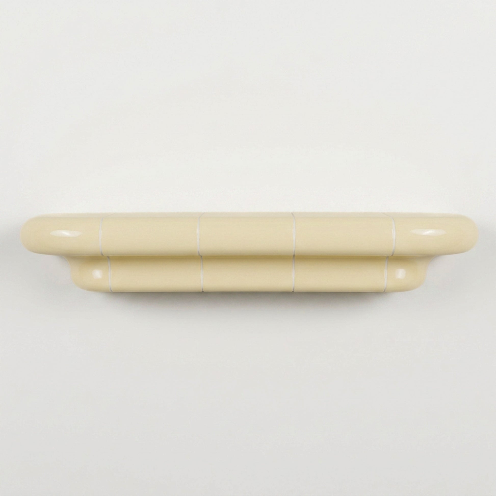 Orbi L contemporary wall shelf in glossy Soft Butter, modular handcrafted design.