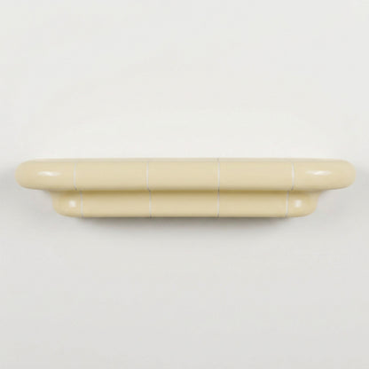 Orbi L contemporary wall shelf in glossy Soft Butter, modular handcrafted design.