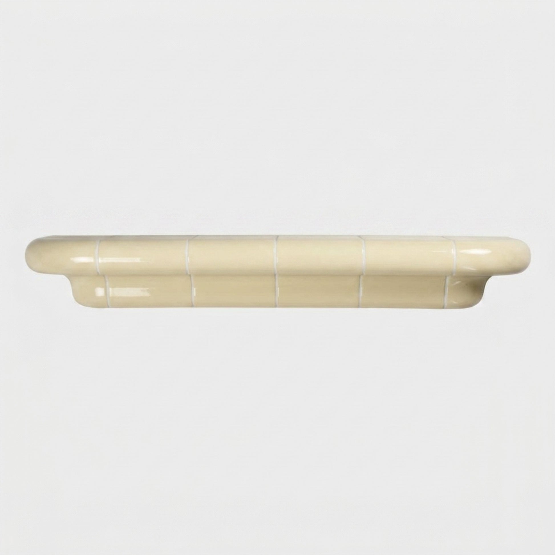 Orbi XL floating shelf in glossy Soft Butter, statement wall shelf for modern interiors.