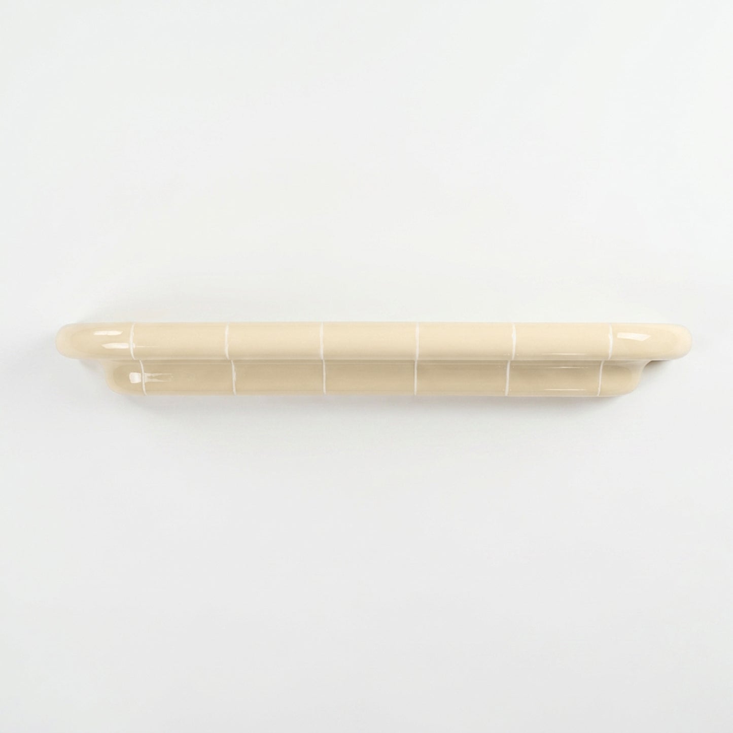 Orbi XXL extra-long floating shelf in glossy Soft Butter, handcrafted modular wall shelf.