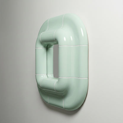 Three-quarter side view of Lolo mirror in Pastel Mint by Tilecito, sculptural square mirror with glossy tile-inspired frame