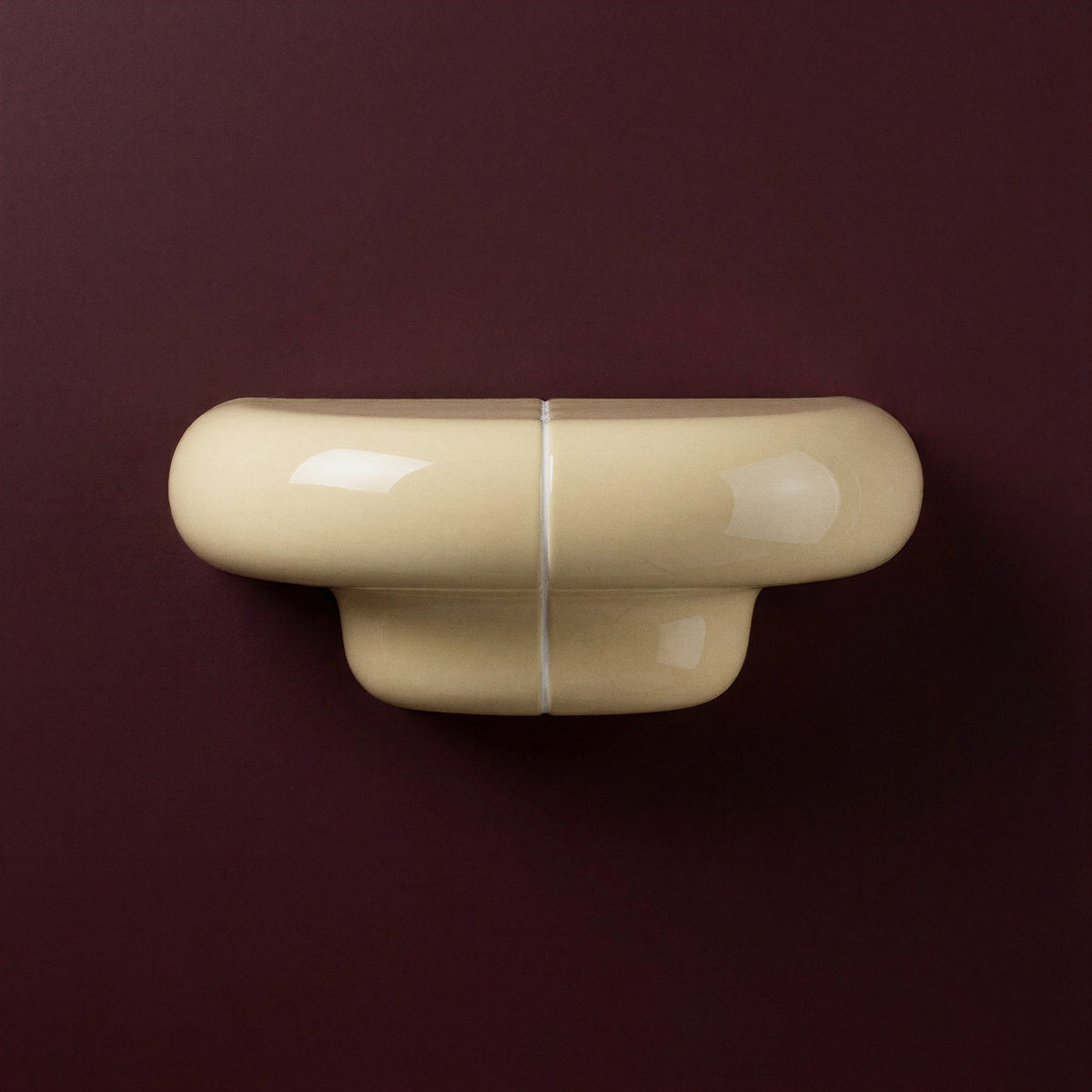 Orbi Shelf Soft Butter on Deep Burgundy Wall